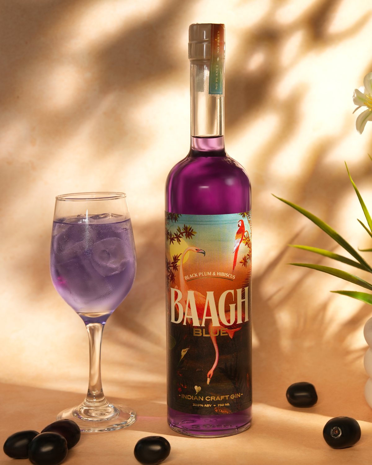 Baagh Blue Indian Craft Gin beside a serve over ice